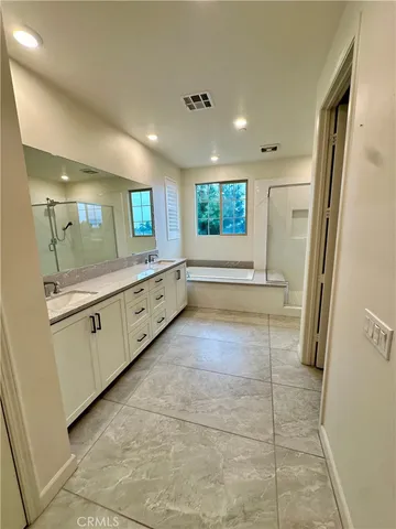 a view of a bathroom with sink and mirror