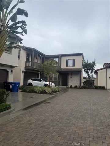 a view of a car park in front of house