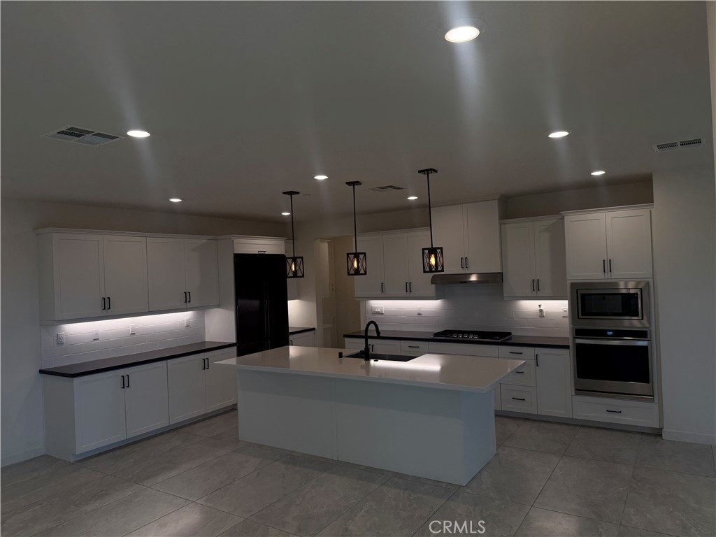 12358 Primrose Avenue Whittier, CA 90602 - Photo 9 of 50 a living room with furniture and a kitchen view