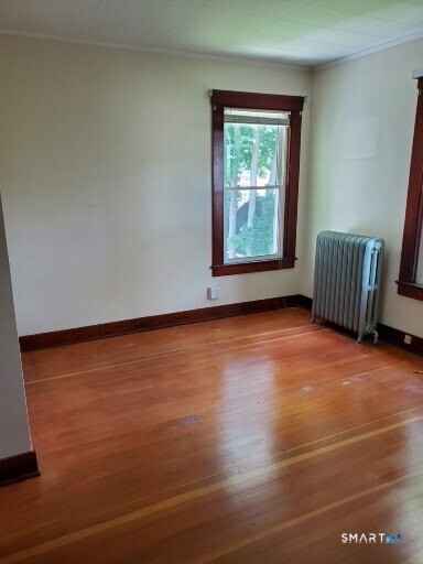 79 Heminway Park Road, Unit 2 Watertown, CT 06795 - Photo 15 of 15 an empty room with wooden floor and windows