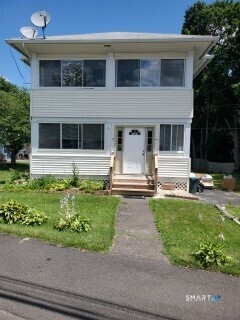 79 Heminway Park Road, Unit 2 Watertown, CT 06795 - Photo 2 of 15 a front view of a house with garden