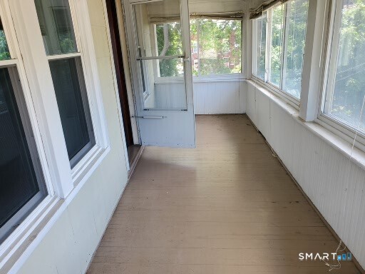 79 Heminway Park Road, Unit 2 Watertown, CT 06795 - Photo 9 of 15 a view of a glass door with a porch