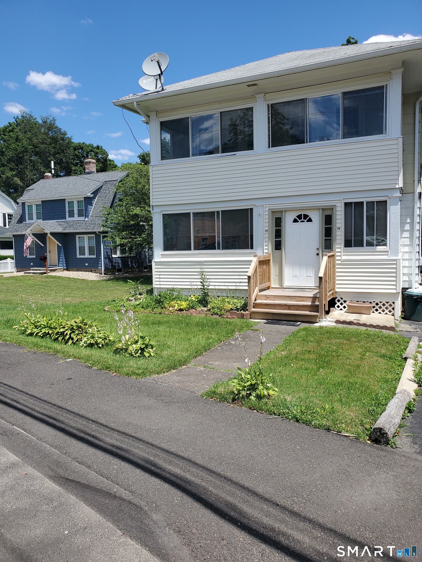79 Heminway Park Road, Unit 2 Watertown, CT 06795 - Photo 10 of 15 a front view of a house with a yard