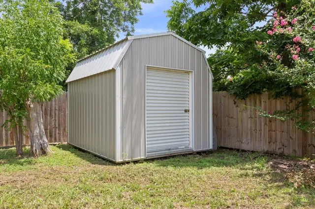 a house with green field in front of it