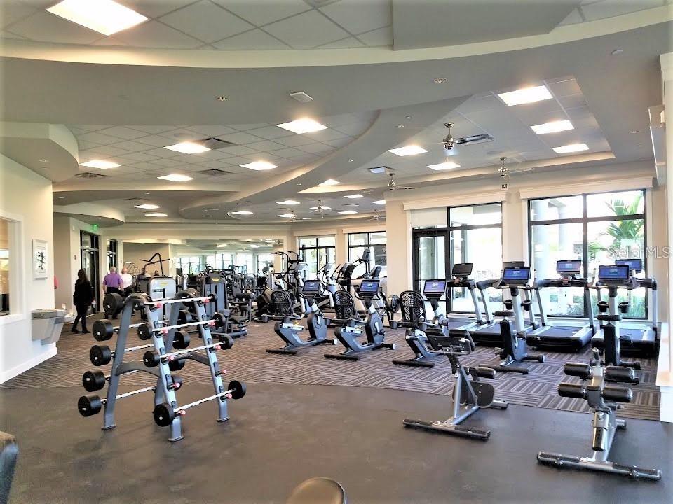 5844 Wake Forest Run, Unit 101 Lakewood Ranch, FL 34211 - Photo 15 of 16 a view of a room with gym equipment