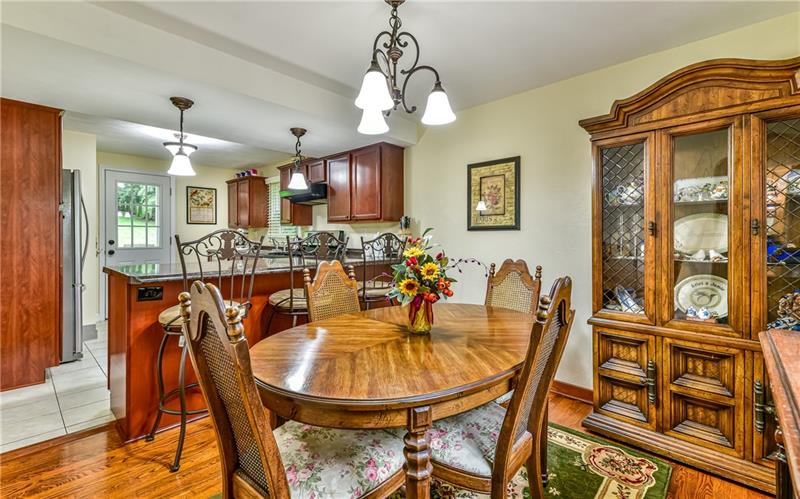 4115 Gibsonia Road Gibsonia, PA 15044 - Photo 5 of 20 The Dining room has beautiful hardwood flooring and a kitchen bar with 3 stools included
