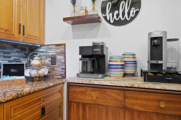 a kitchen with a sink and a microwave
