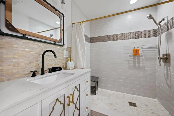 a kitchen with a sink and a refrigerator