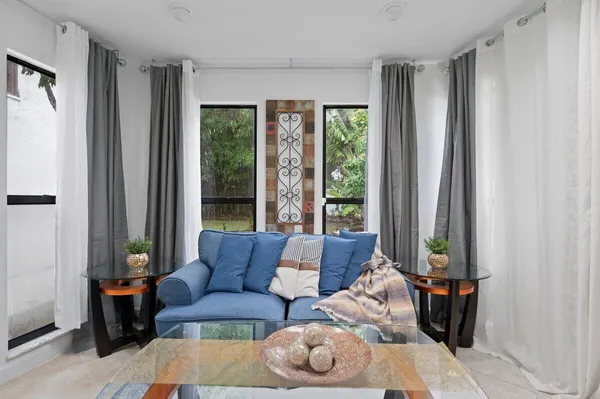 a living room with furniture and a window