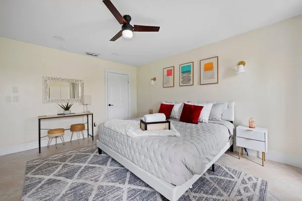 a bedroom with a bed and a table