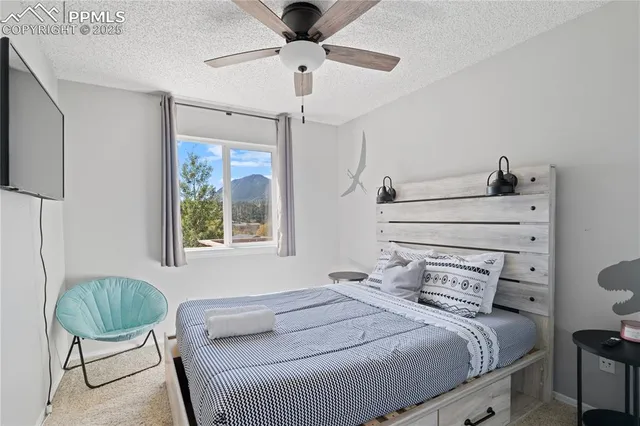 a bedroom with a bed and a chair