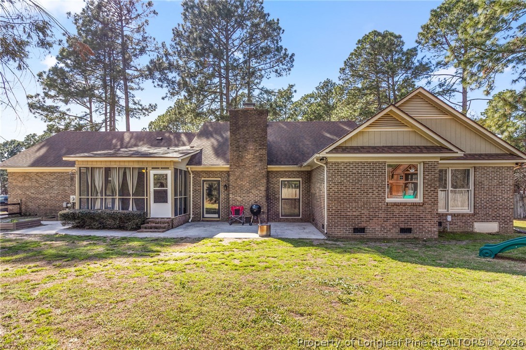 7756 Dragonhead Road Fayetteville, NC 28311 - Photo 41 of 42 a front view of a house with a yard outdoor seating and yard