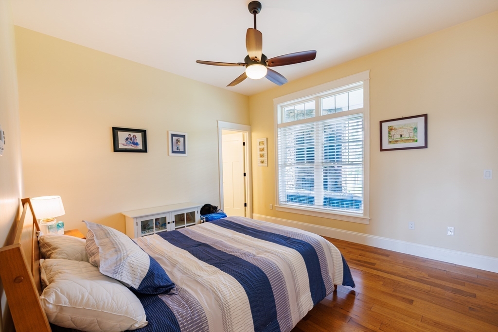 1776 Old Turnpike Road Oakham, MA 01068 - Photo 22 of 42 a bedroom with a bed and wooden floor