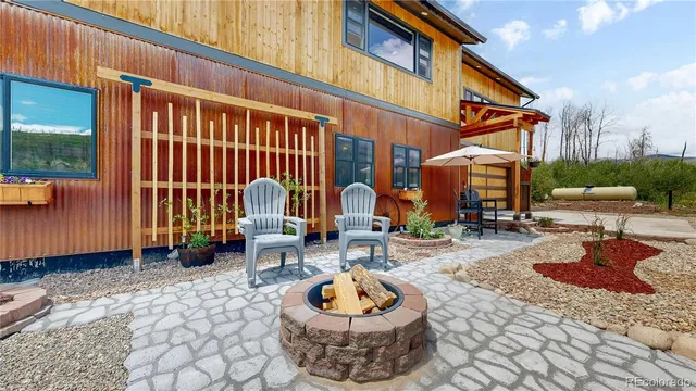 a building outdoor space with patio furniture and potted plants