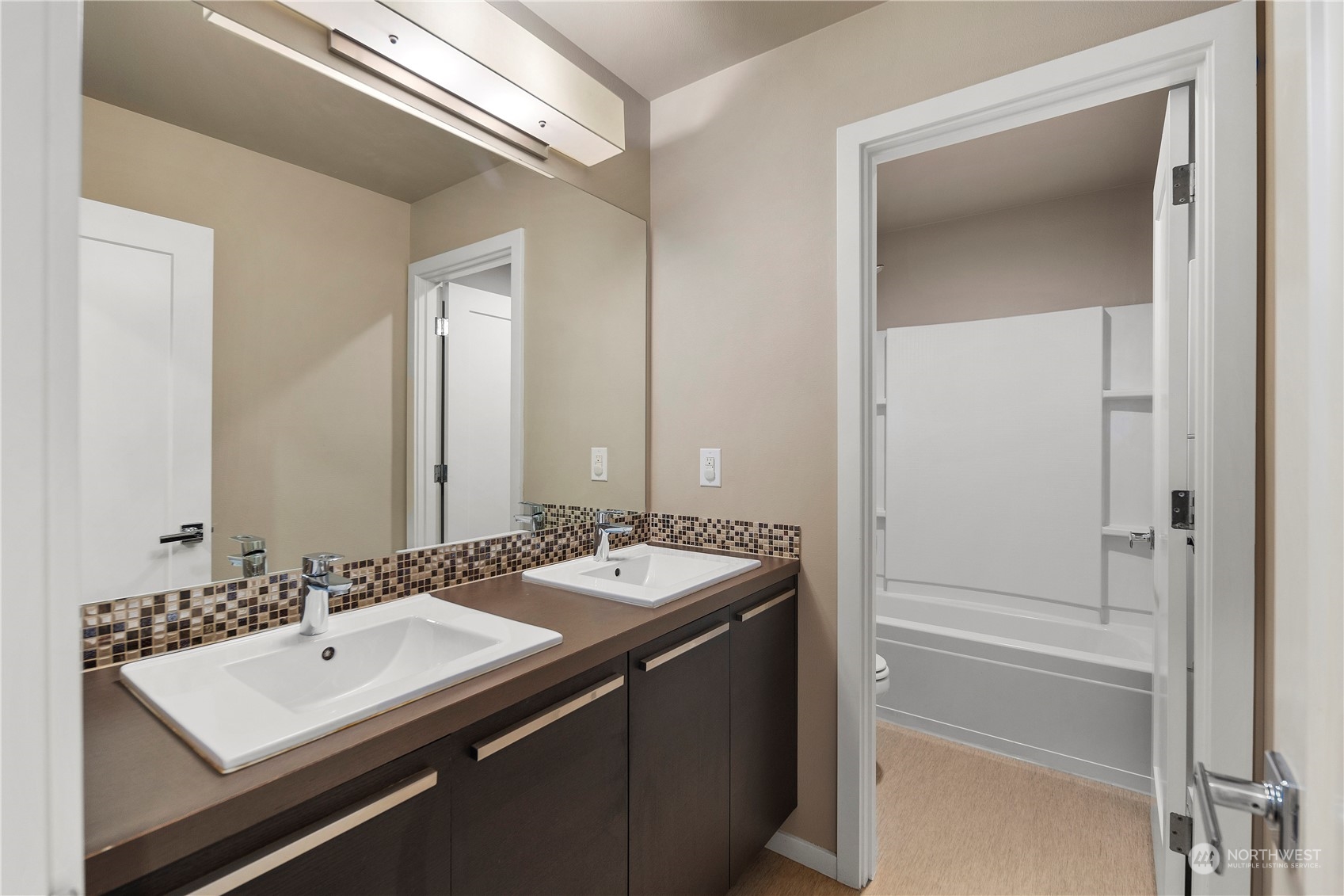 4108 171st Street Southeast Bothell, WA 98012 - Photo 26 of 40 a bathroom with a sink a mirror and a vanity