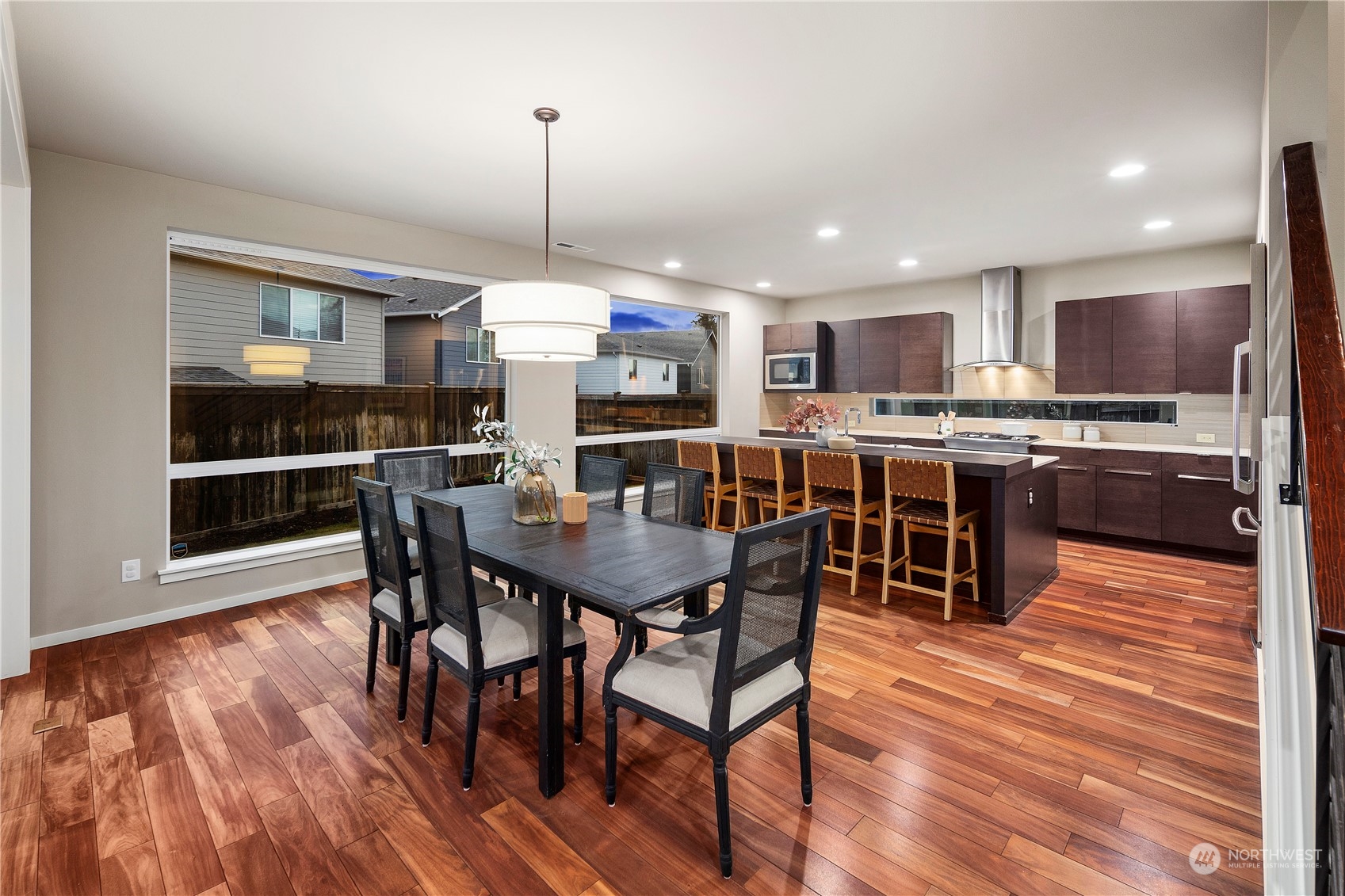 4108 171st Street Southeast Bothell, WA 98012 - Photo 8 of 40 a view of a dining room with furniture wooden floor and chandelier