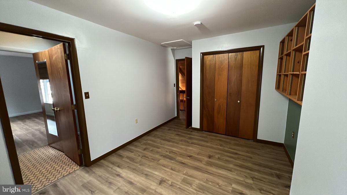 6728 Hemlock Point Road New Market, MD 21774 - Photo 13 of 28 a view of a hallway with wooden floor and entryway