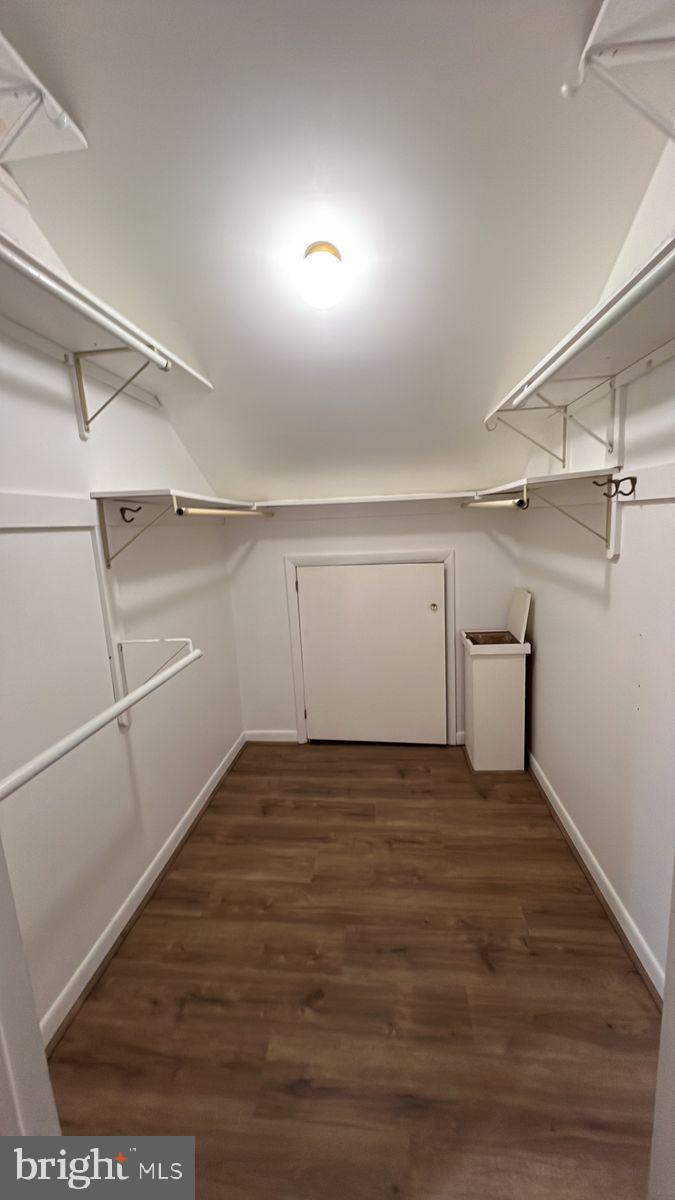 6728 Hemlock Point Road New Market, MD 21774 - Photo 16 of 28 a view of a room with an empty space and wooden floor