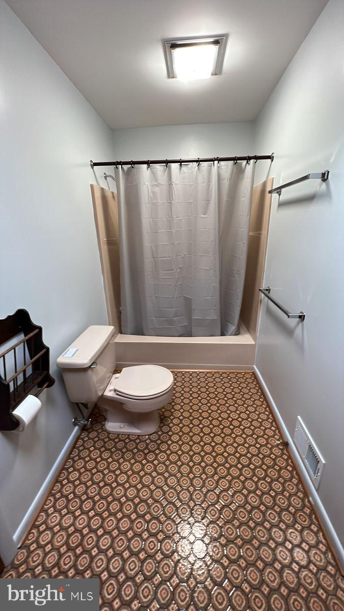 6728 Hemlock Point Road New Market, MD 21774 - Photo 18 of 28 a bathroom with a toilet and a shower