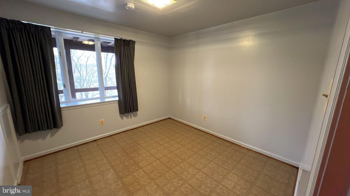 6728 Hemlock Point Road New Market, MD 21774 - Photo 19 of 28 an empty room with windows