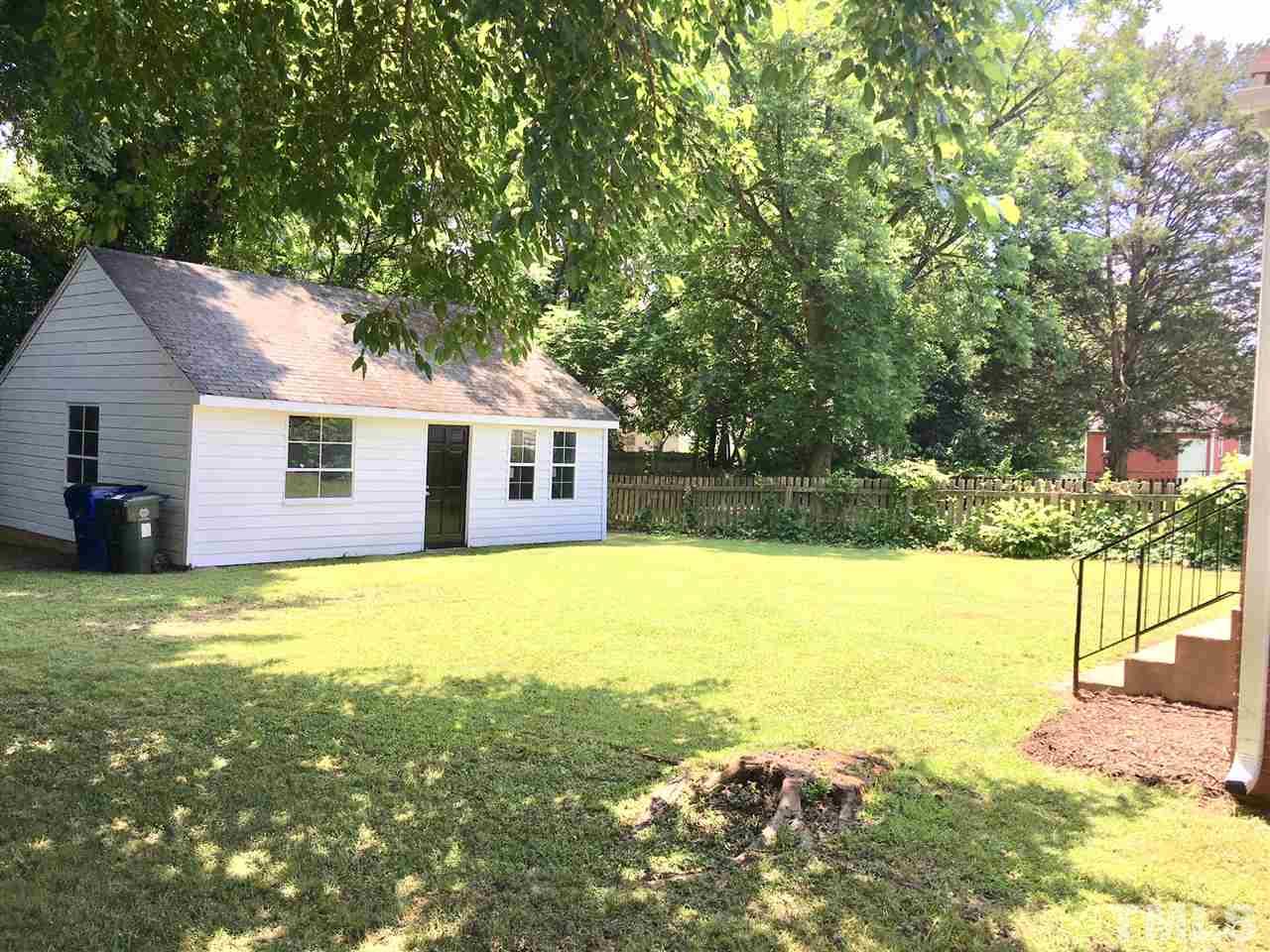 612 Brighton Road Raleigh, NC 27610 - Photo 13 of 16 a view of a house with pool and a yard