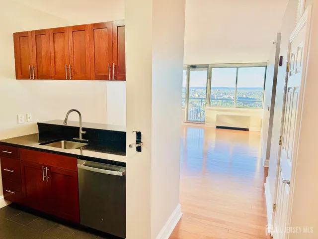 a kitchen with a sink and cabinets