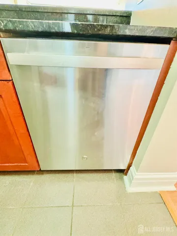 a view of a living room with furniture and wooden floor