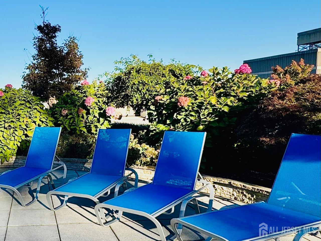 1 Spring Street, Unit 1806 New Brunswick, NJ 08901 - Photo 47 of 65 a view of a chairs and table in backyard