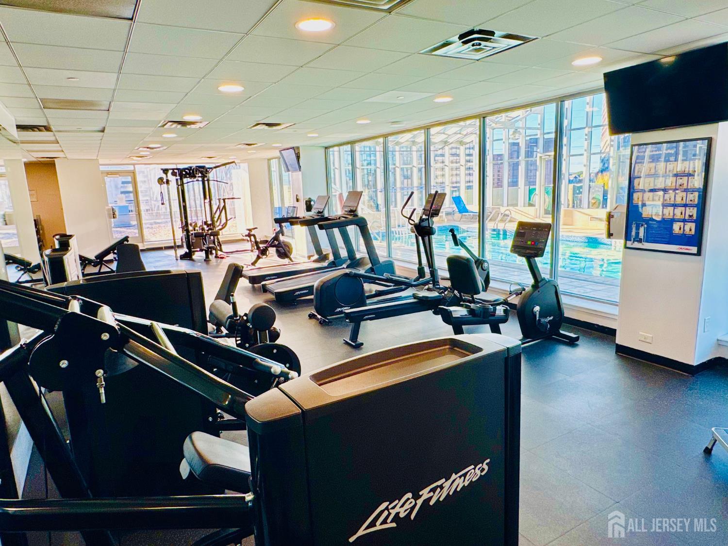 1 Spring Street, Unit 1806 New Brunswick, NJ 08901 - Photo 55 of 65 a view of a room with gym equipment