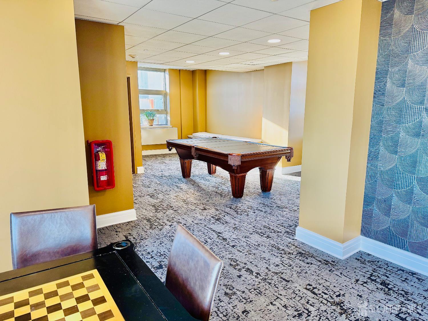 1 Spring Street, Unit 1806 New Brunswick, NJ 08901 - Photo 61 of 65 a room with pool table and windows