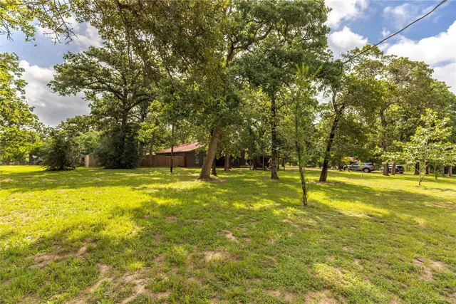 a view of a swimming pool with an outdoor space and seating area