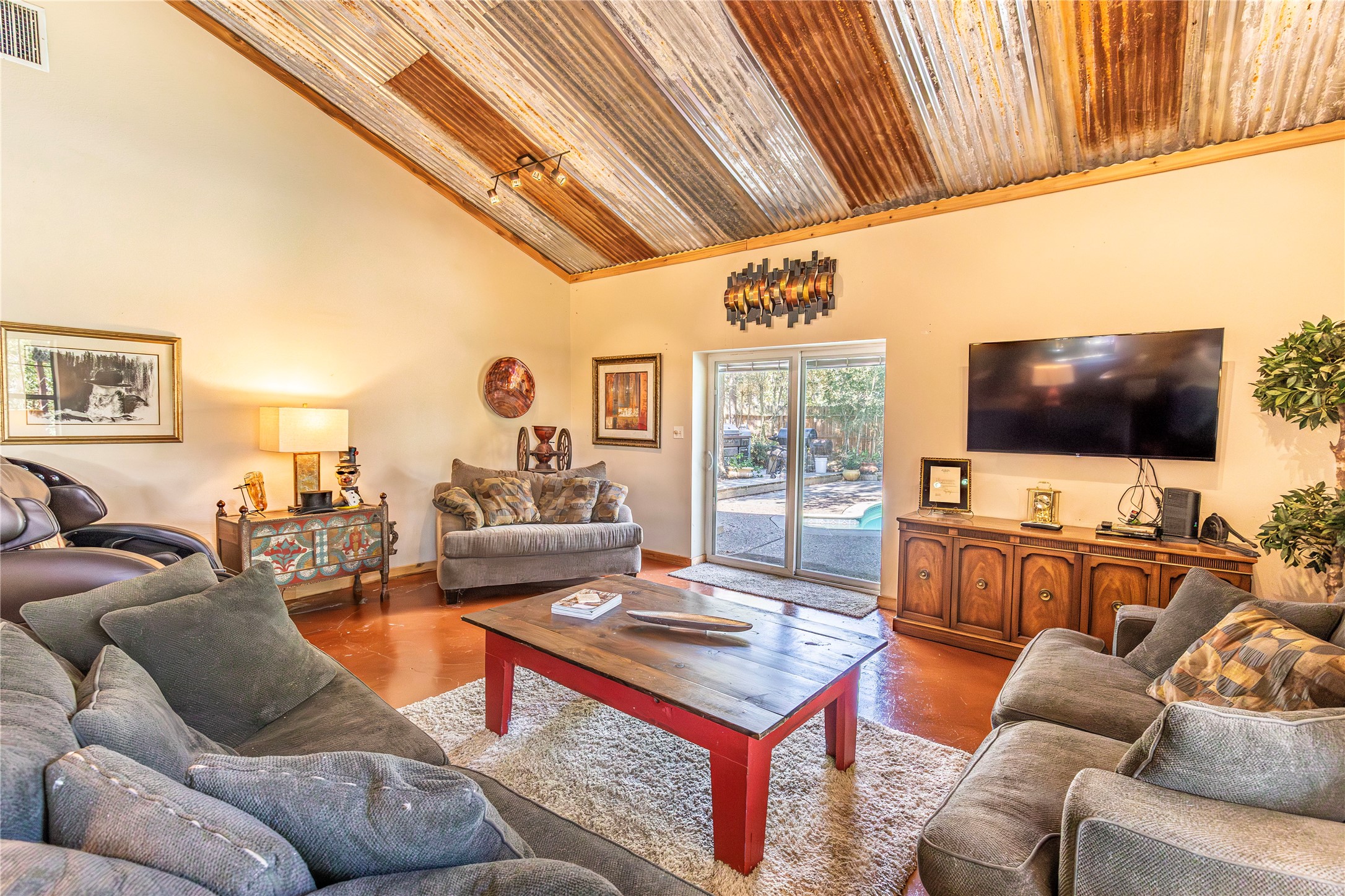 7710 Highway 36 Bellville, TX 77418 - Photo 7 of 25 The living room opens directly to the pool area, perfect for indoor-outdoor living.