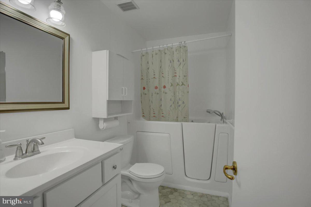 5671 Crabapple Drive Frederick, MD 21703 - Photo 13 of 31 a bathroom with a sink toilet and shower