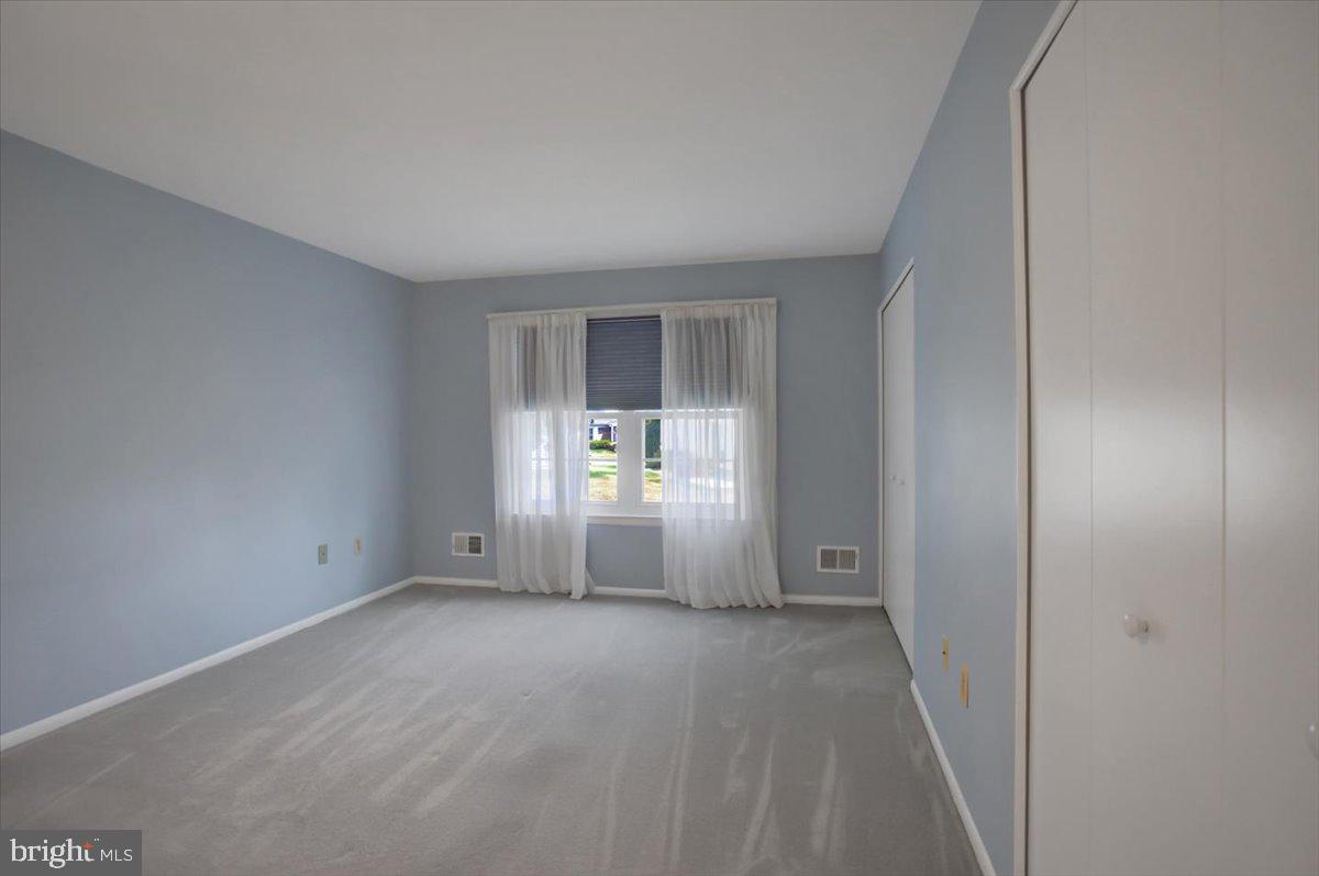 5671 Crabapple Drive Frederick, MD 21703 - Photo 17 of 31 a view of an empty room with a window