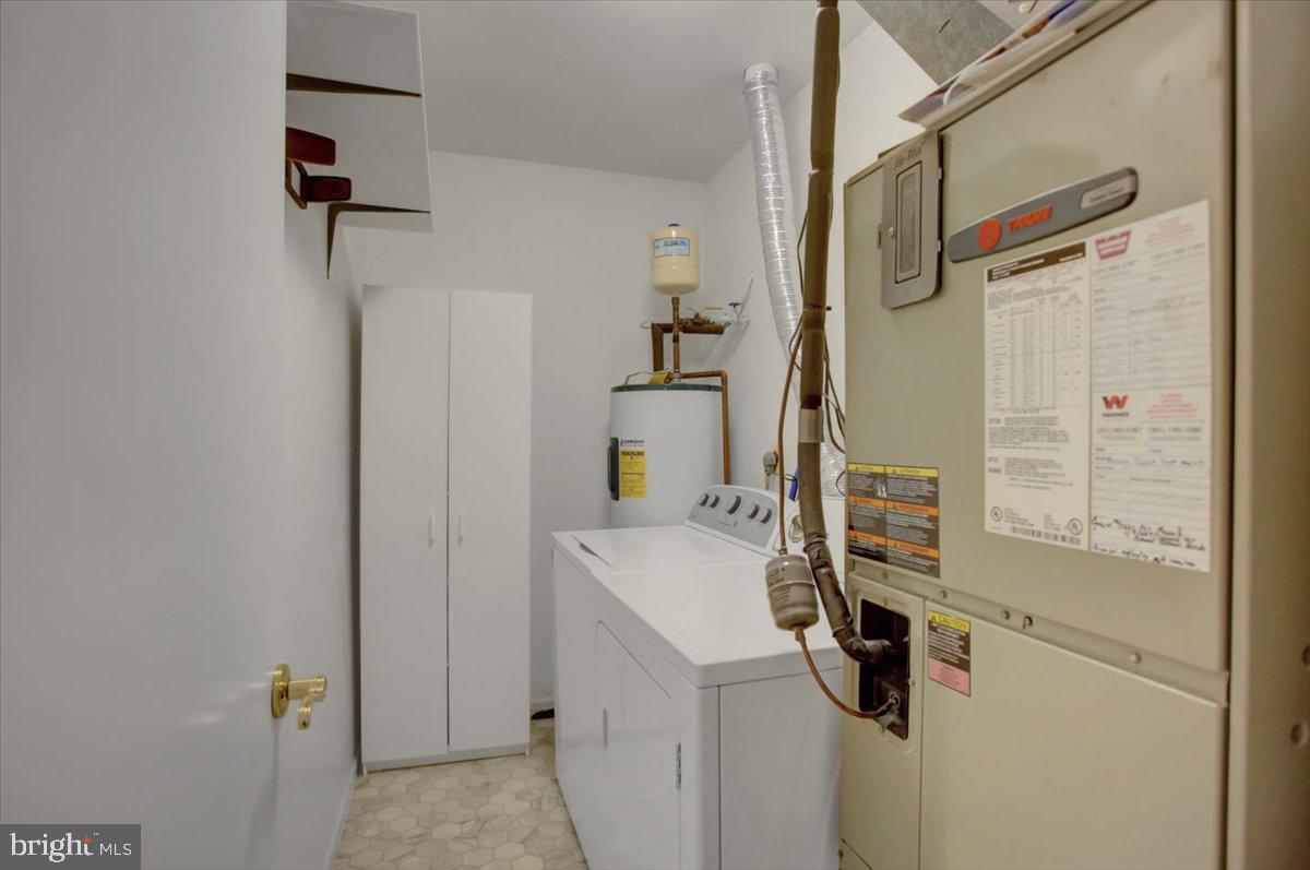 5671 Crabapple Drive Frederick, MD 21703 - Photo 22 of 31 a bathroom with a shower and mirror