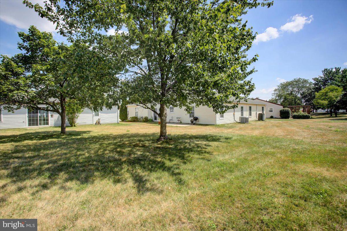 5671 Crabapple Drive Frederick, MD 21703 - Photo 24 of 31 a yellow building in the middle of a yard