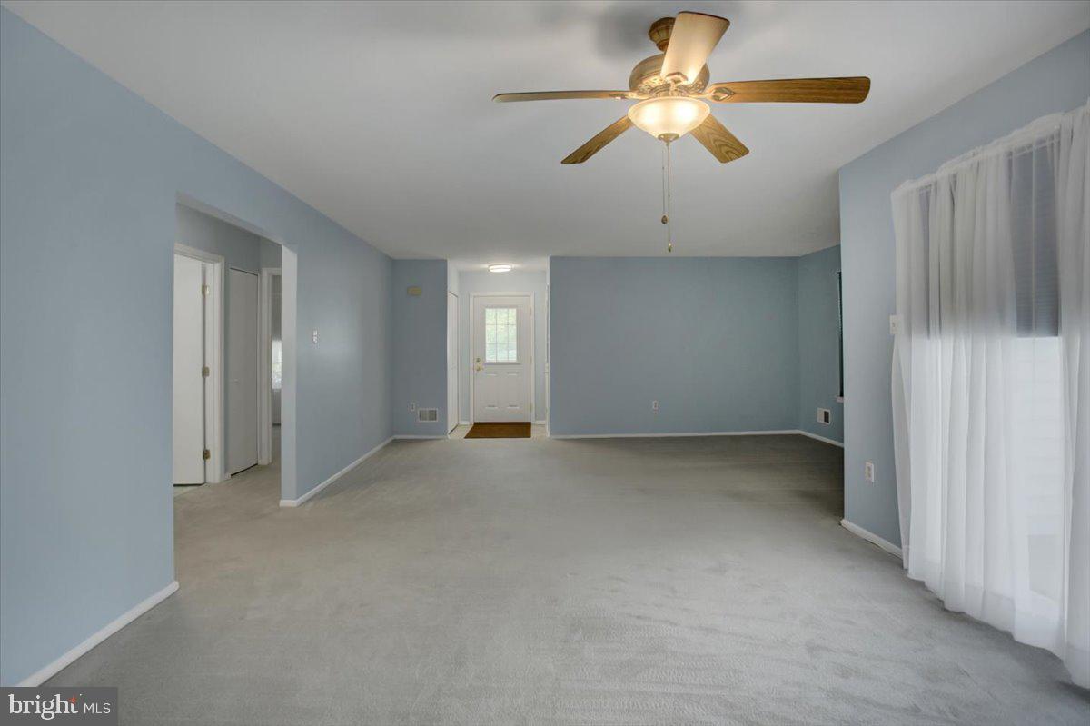 5671 Crabapple Drive Frederick, MD 21703 - Photo 6 of 31 a view of an empty room and chandelier fan