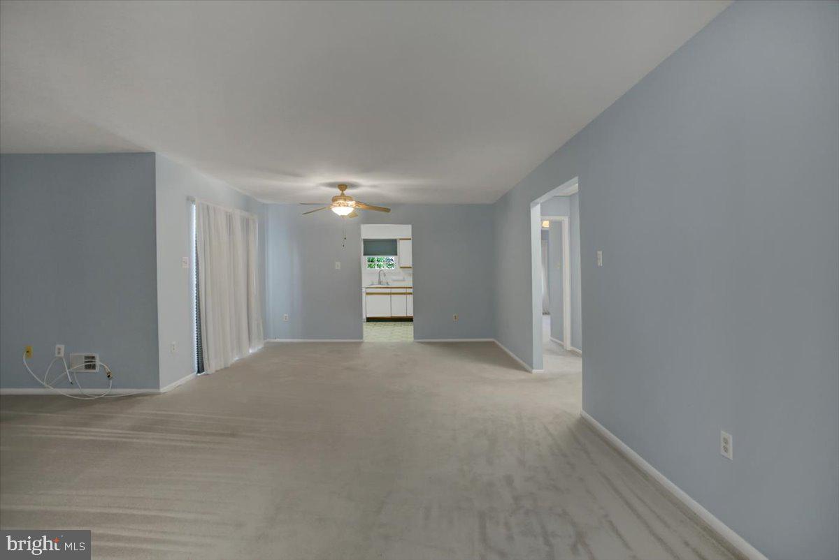 5671 Crabapple Drive Frederick, MD 21703 - Photo 7 of 31 a view of an empty room with a window