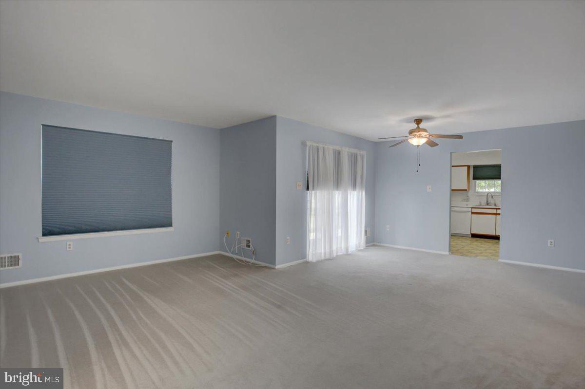 5671 Crabapple Drive Frederick, MD 21703 - Photo 9 of 31 a view of an empty room with a window