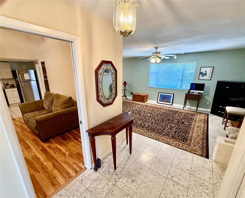 1004 Connecticut Road Tarpon Springs, FL 34689 - Photo 9 of 57 a living room with furniture and a window