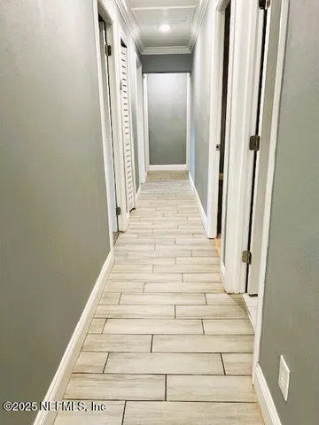 a kitchen with stainless steel appliances granite countertop a stove a sink and white cabinets