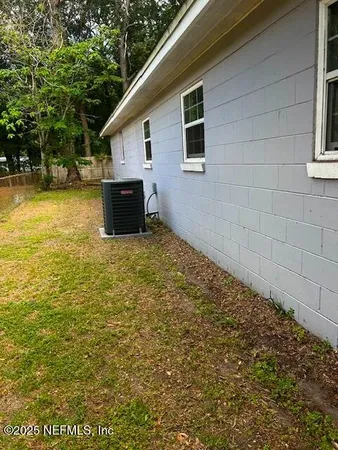 a view of house with backyard and swimming pool