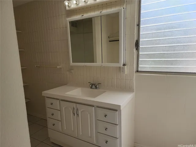 a bathroom with a toilet a sink and shower