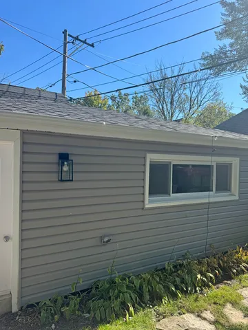 a view of a house next to a yard