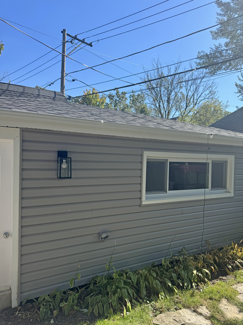644 West Hinsdale Avenue Hinsdale, IL 60521 - Photo 15 of 17 a view of a house next to a yard