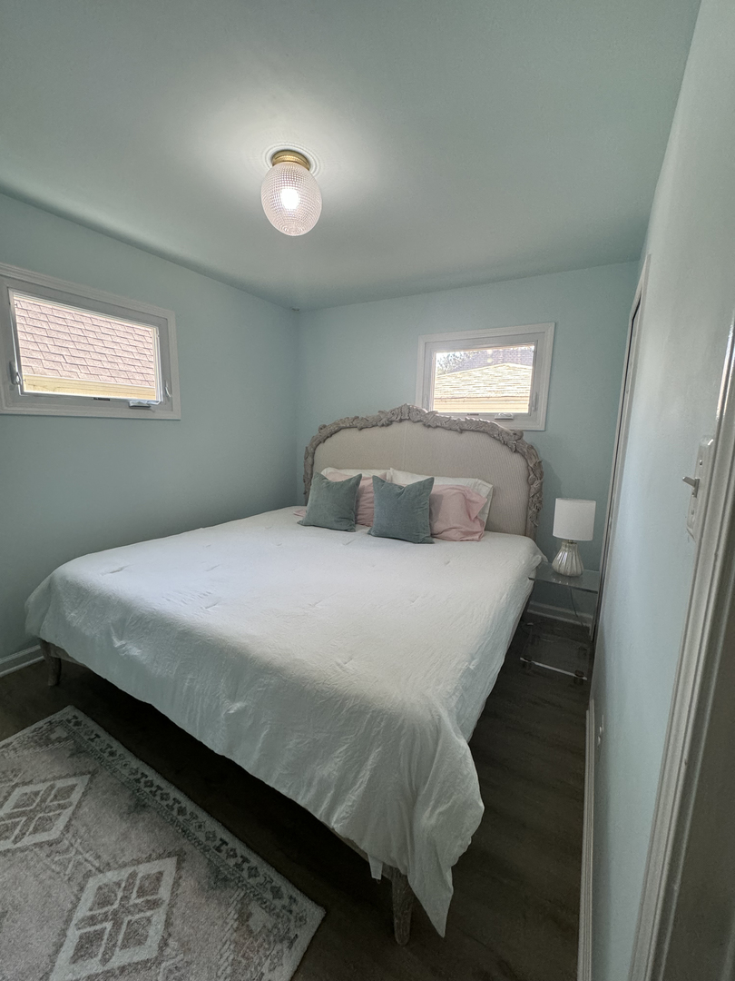 644 West Hinsdale Avenue Hinsdale, IL 60521 - Photo 4 of 17 a bedroom with a bed and a window