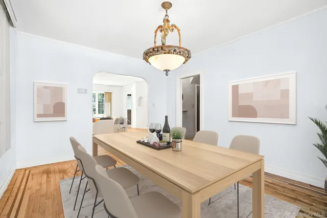a dining room with a table and chairs