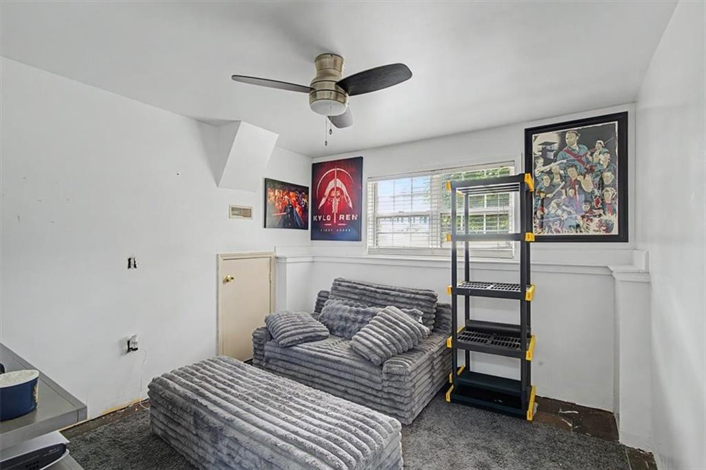 409 Windsor Way Canton, GA 30115 - Photo 20 of 51 a bedroom with furniture and a ceiling fan