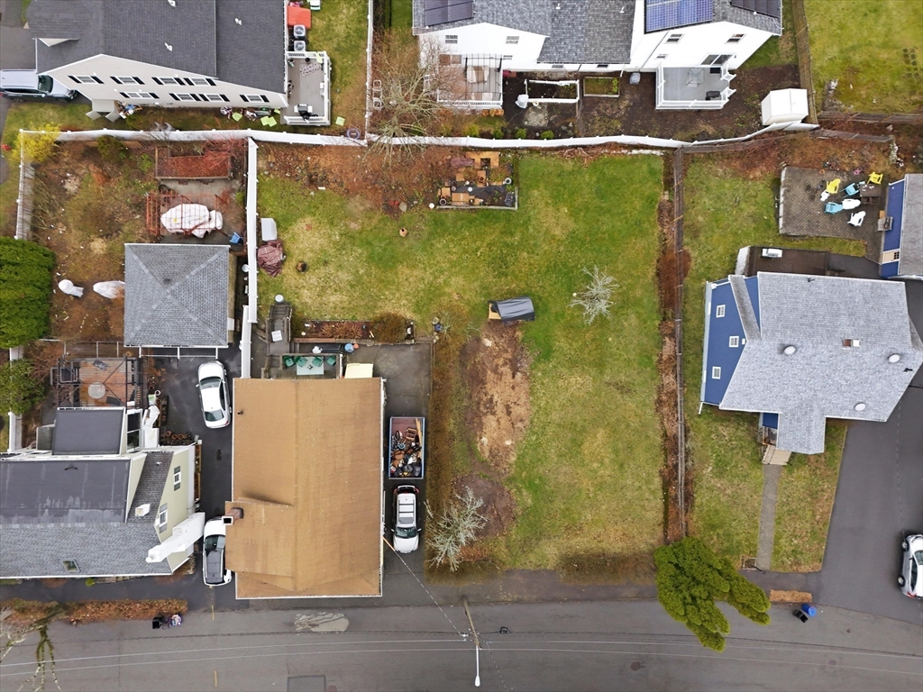 an aerial view of a house with a garden