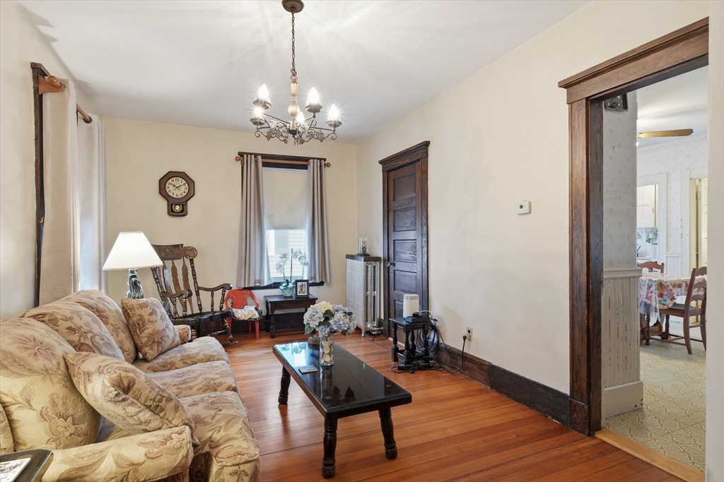 24 Fairview Avenue Swampscott, MA 01907 - Photo 14 of 39 a living room with furniture and a chandelier